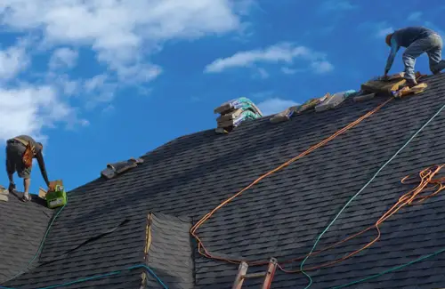 Homerun Roofing and Construction workers working on roof of customer