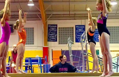 Westwood Gymnastics and Dance; girls practicing on the balance beam; ballet dance gymnastics camps