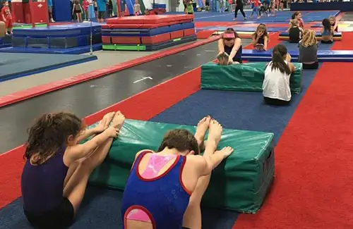 Westwood Gymnastics and Dance; students stretching before class